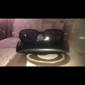 Black sunglasses new never worn. Item comes with a sturdy carrying case.